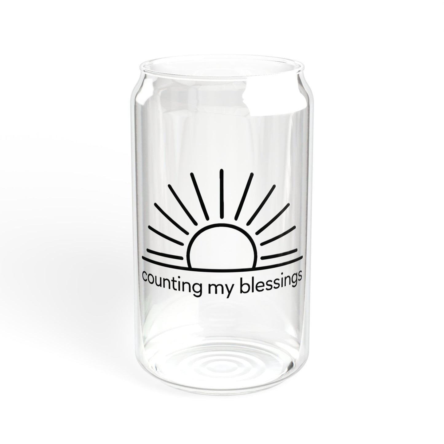 Clear glass vase with a black sun design and 'counting my blessings' text on a white background