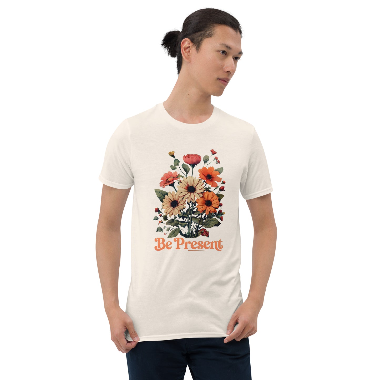 Man wearing a natural t-shirt with a floral design and 'Be Present' text on a white background