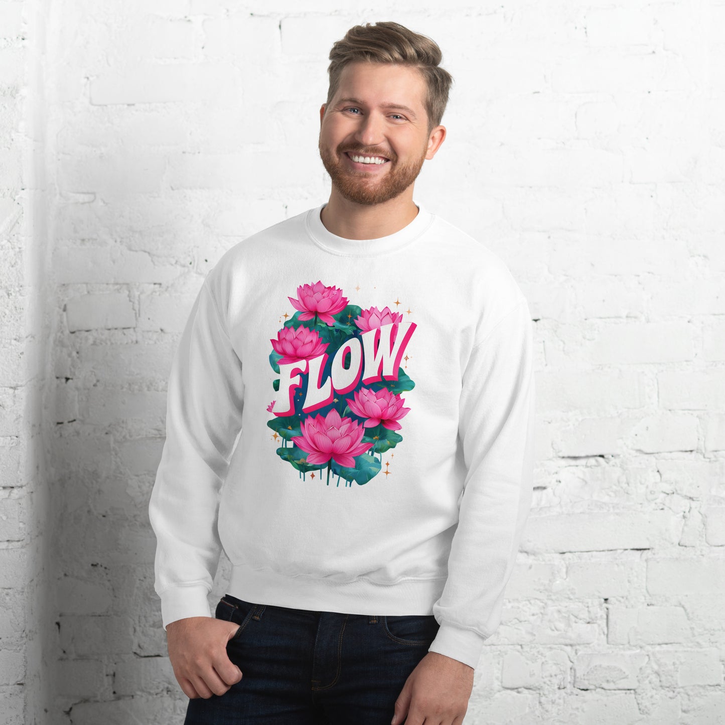 Man wearing a white sweatshirt with pink floral design and 'FLOW' text against a white brick wall.