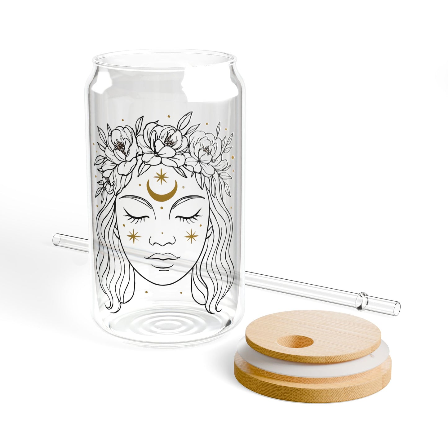 Glass tumbler with a woman's face design, wooden lid, and straw on a white background