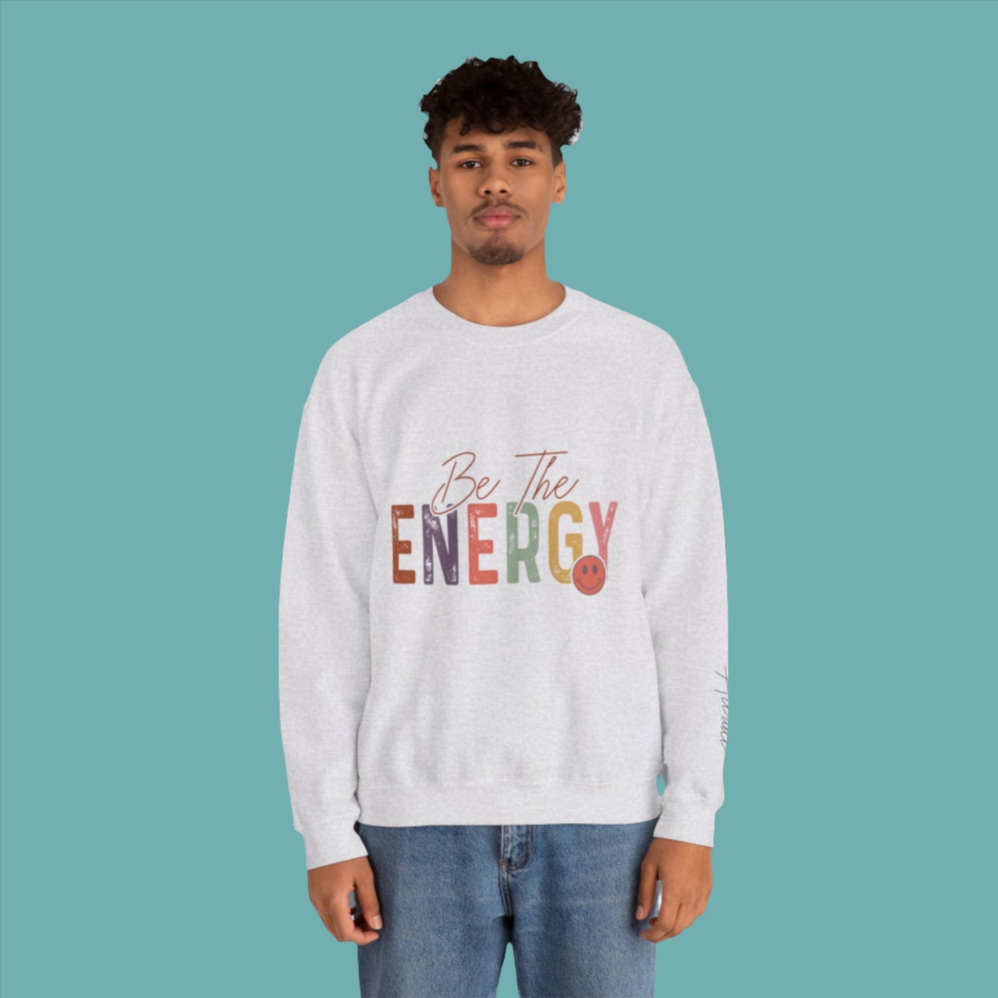 man wearing unsiex  grey be the energy you want to attract sweatshirt