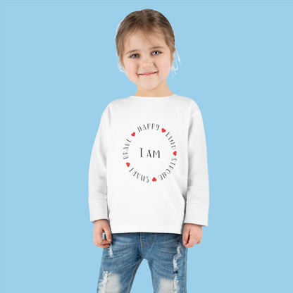 child wearing an I am Toddler Long Sleeve Tee