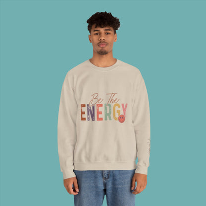 man wearing unisex  be the energy you want to attract sweatshirt