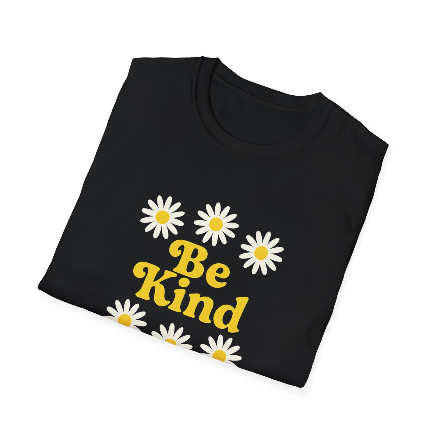 Folded Black t-shirt with 'Be Kind' text and daisy flowers on a white background