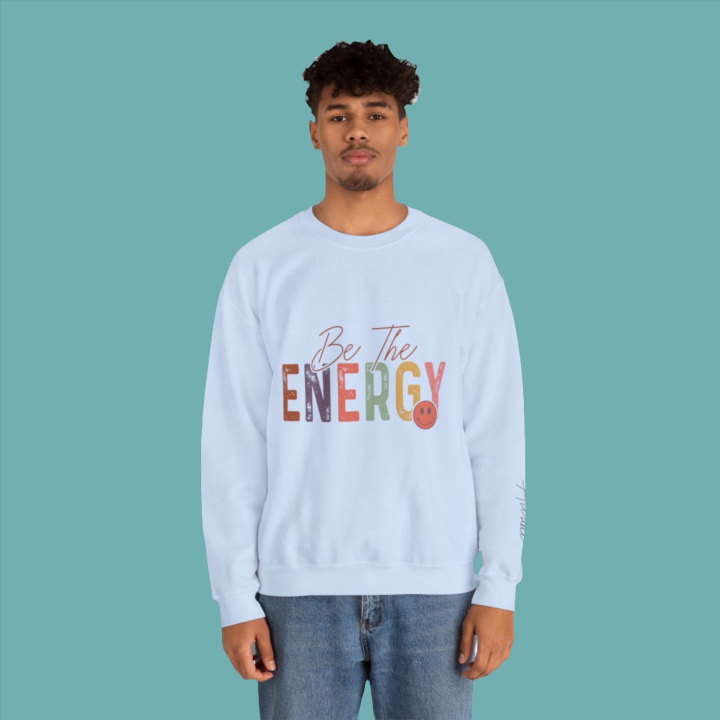 man wearing unisex blue be the energy you want to attract sweatshirt