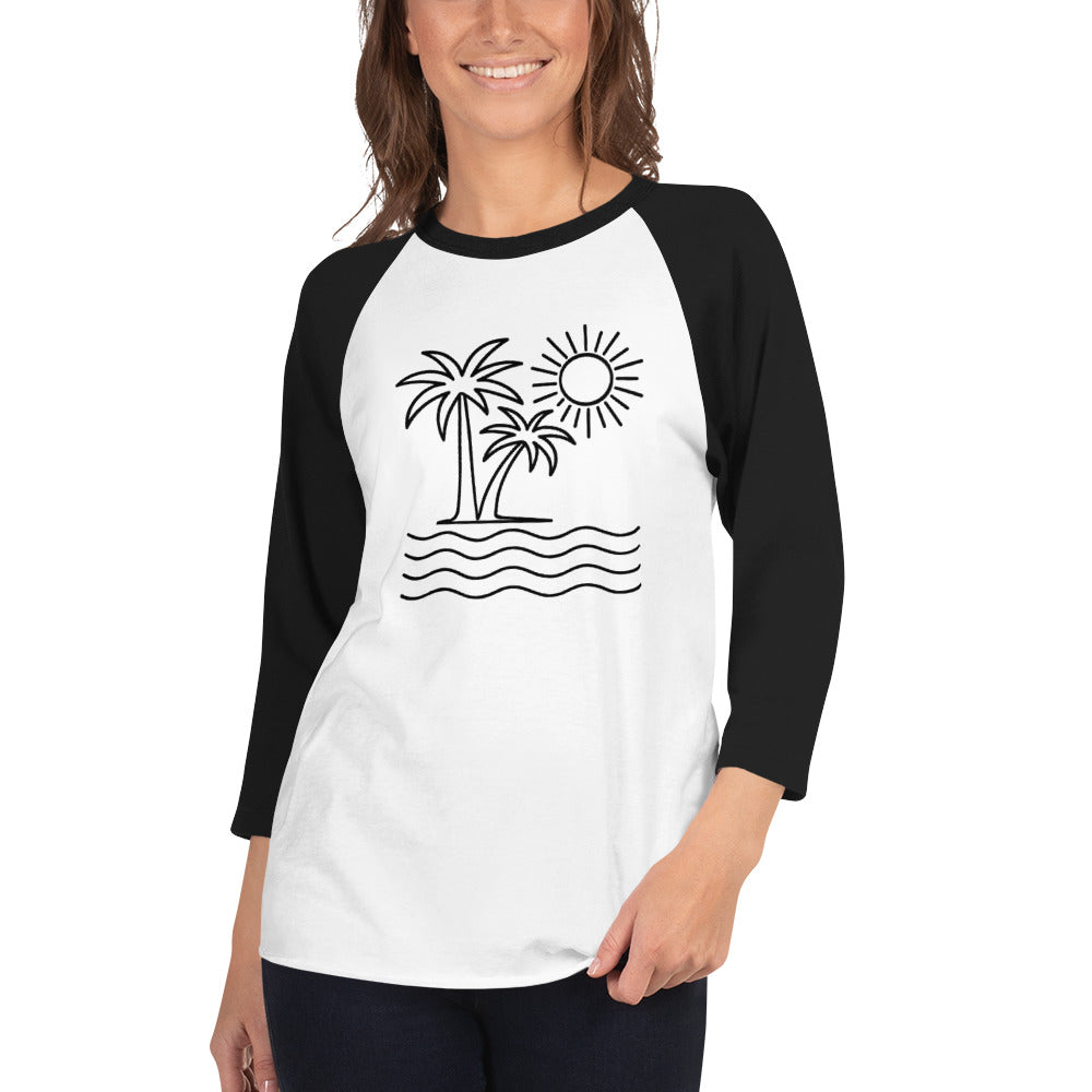 Woman wearing a black and white baseball shirt with palm tree and sun design.