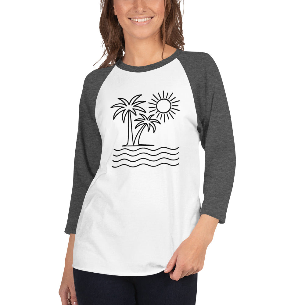 Woman wearing a white and gray baseball shirt with a palm tree and sun design.