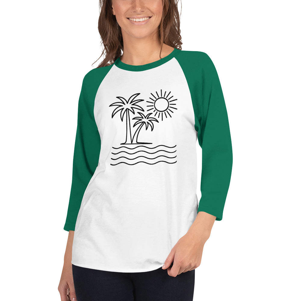 Woman wearing a white and green baseball shirt with a palm tree and sun design.