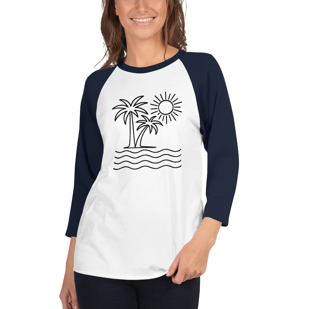 Woman wearing a white and navy baseball shirt with a palm tree and sun design.