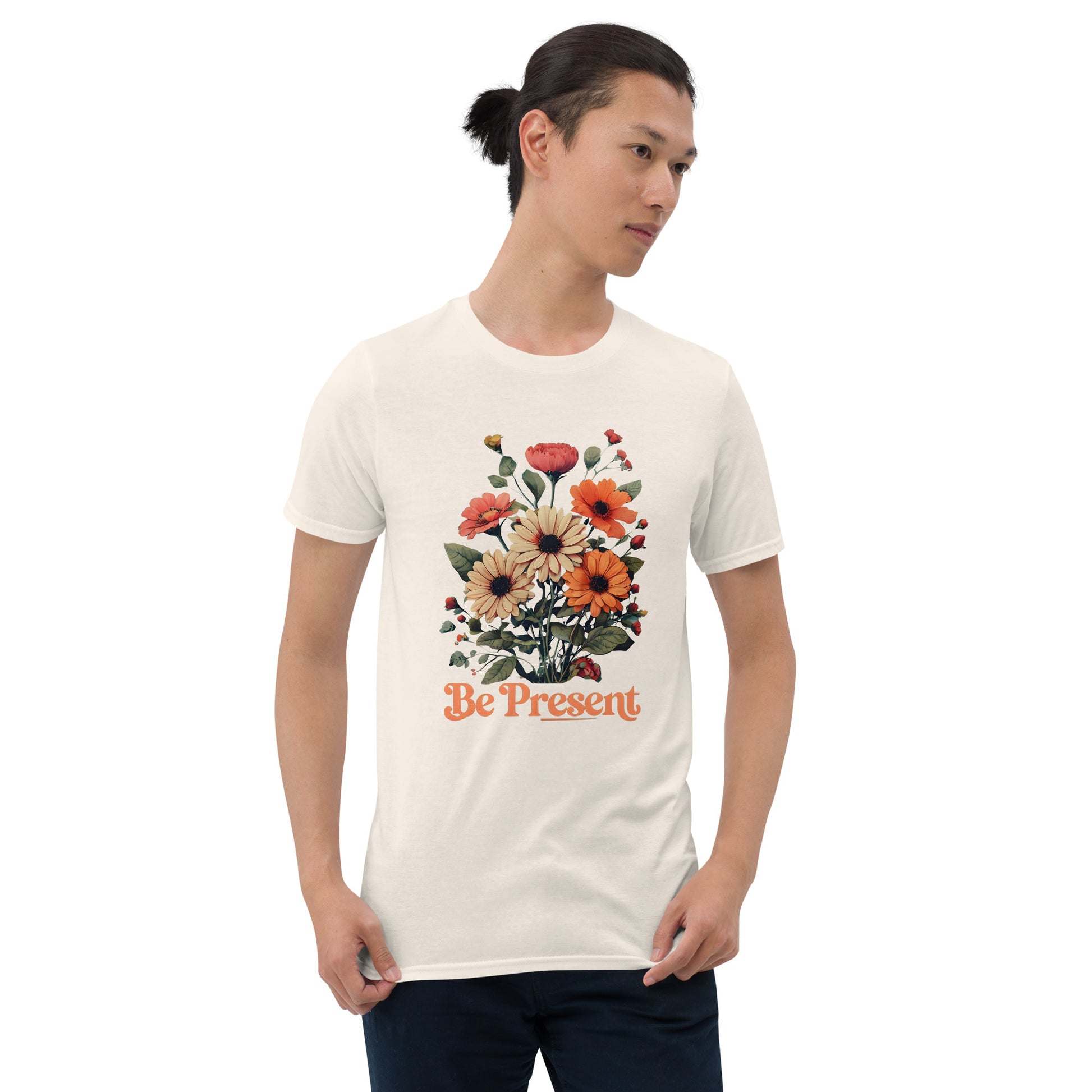 Man wearing a natural t-shirt with a floral design and 'Be Present' text on a white background