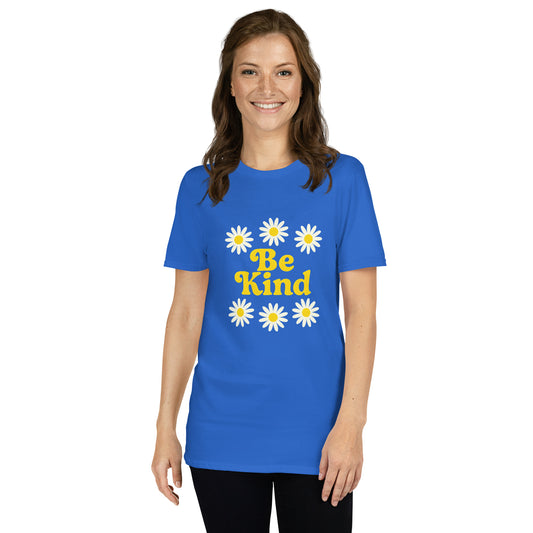Woman wearing a blue t-shirt with 'Be Kind' and daisy flowers on a white background