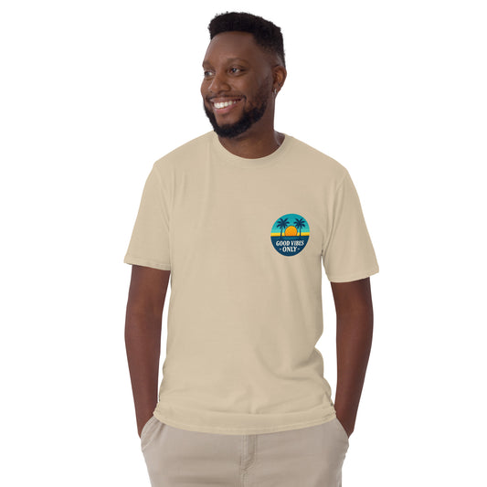 Man wearing a beige t-shirt with a good vibes only design on a white background