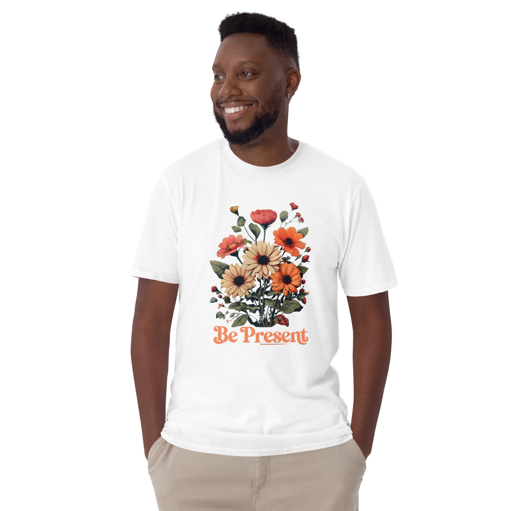 Man wearing a white t-shirt with a floral design and 'Be Present' text on a white background