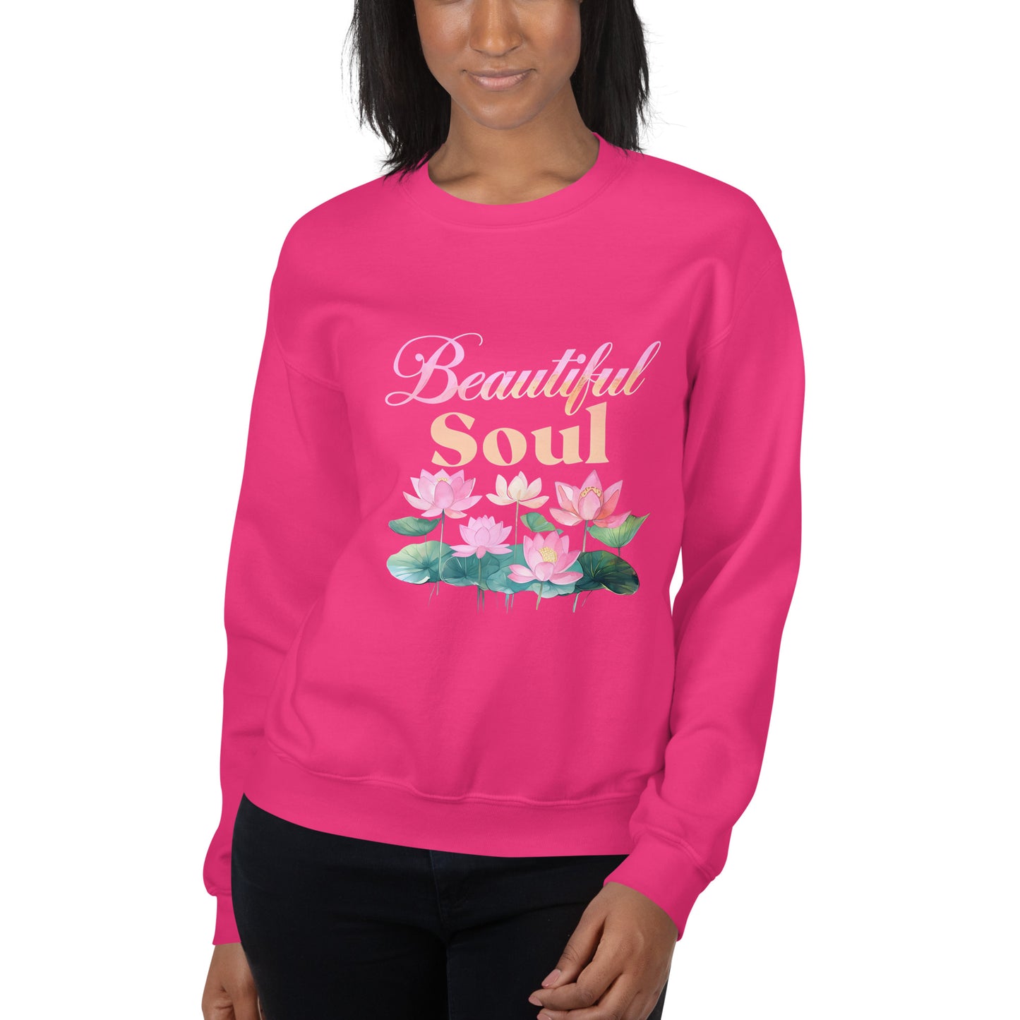Person wearing a pink sweatshirt with 'Beautiful Soul' and lotus flower design on a white background