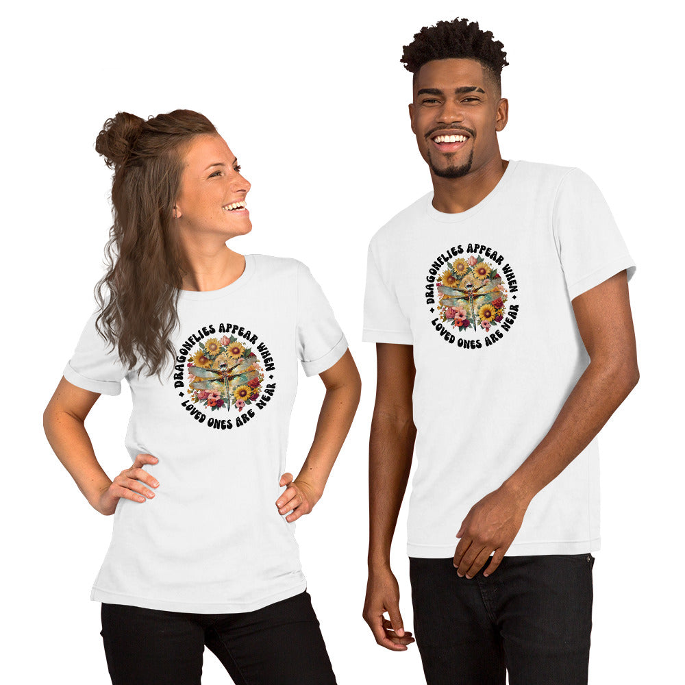 Two people wearing white t-shirts with a colorful graphic design on a white background