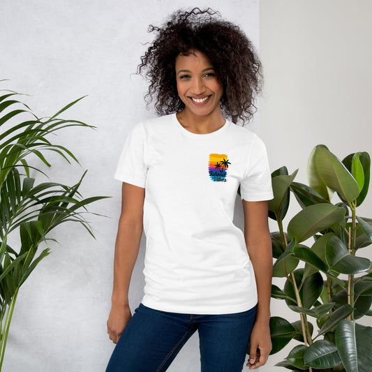 woman wearing white Unisex Island Vibes t-shirt with tropical graphic, perfect for summer, beach days, and vacation wear